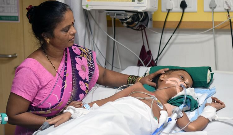 My Son is lying unconscious and I urgently need your help to save hin,Kitto